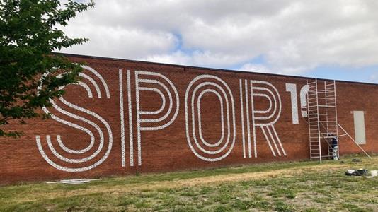 SPOR10 logo on wall